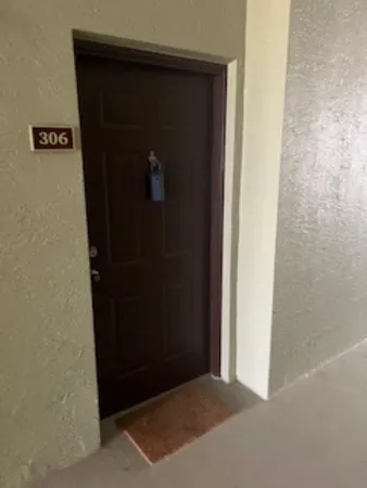 a large bed sitting in a bedroom next to a window