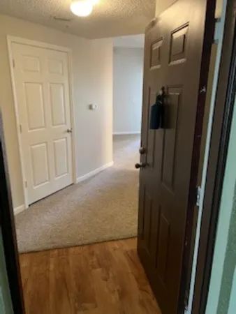 a view of a hallway with closet