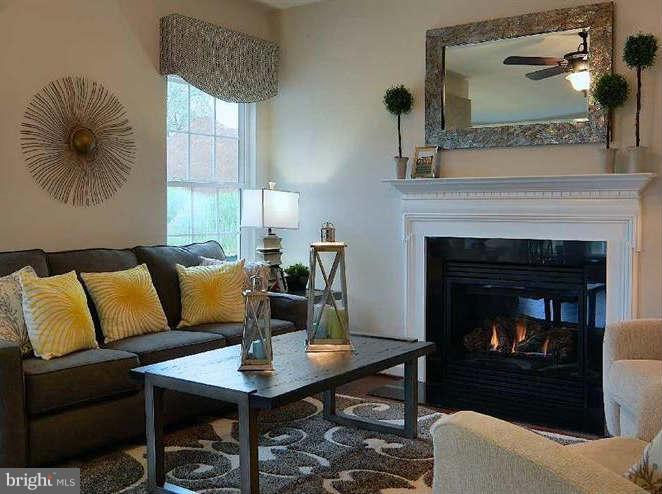 2643 St Marys View Road Accokeek, MD 20607 - Photo 6 of 20 a living room with furniture and a fireplace