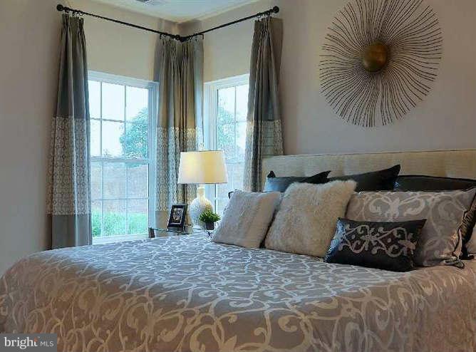 2643 St Marys View Road Accokeek, MD 20607 - Photo 7 of 20 a bedroom with a large bed and a window