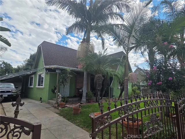 a view of house with yard outdoor seating and entertaining space