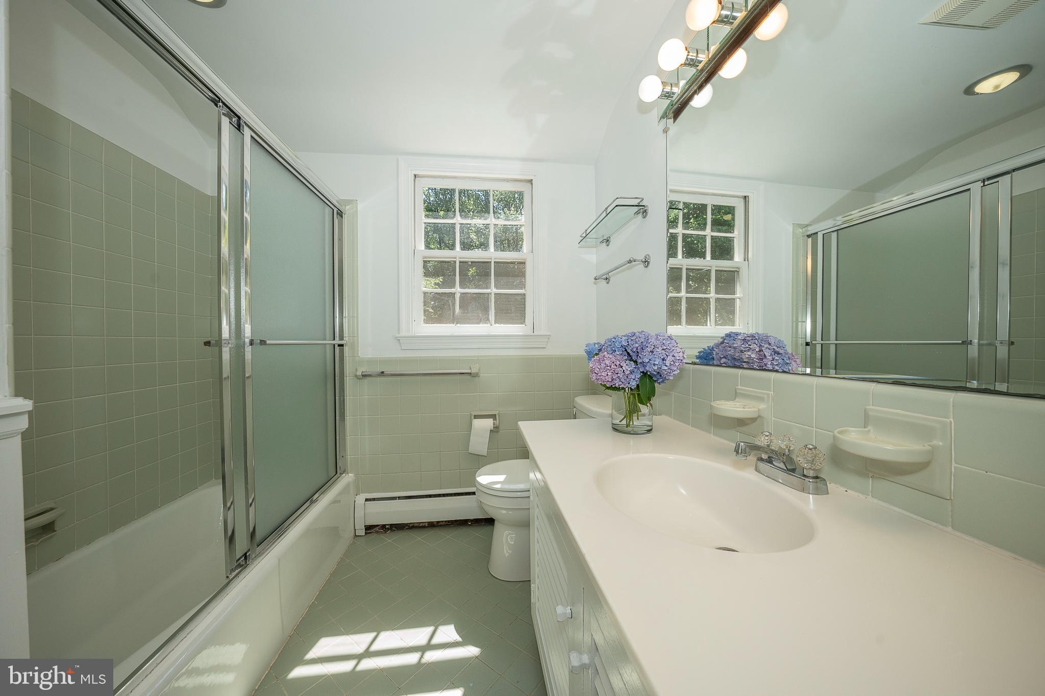 820 Milmar Road Newtown Square, PA 19073 - Photo 14 of 32 a bathroom with a sink a toilet and shower