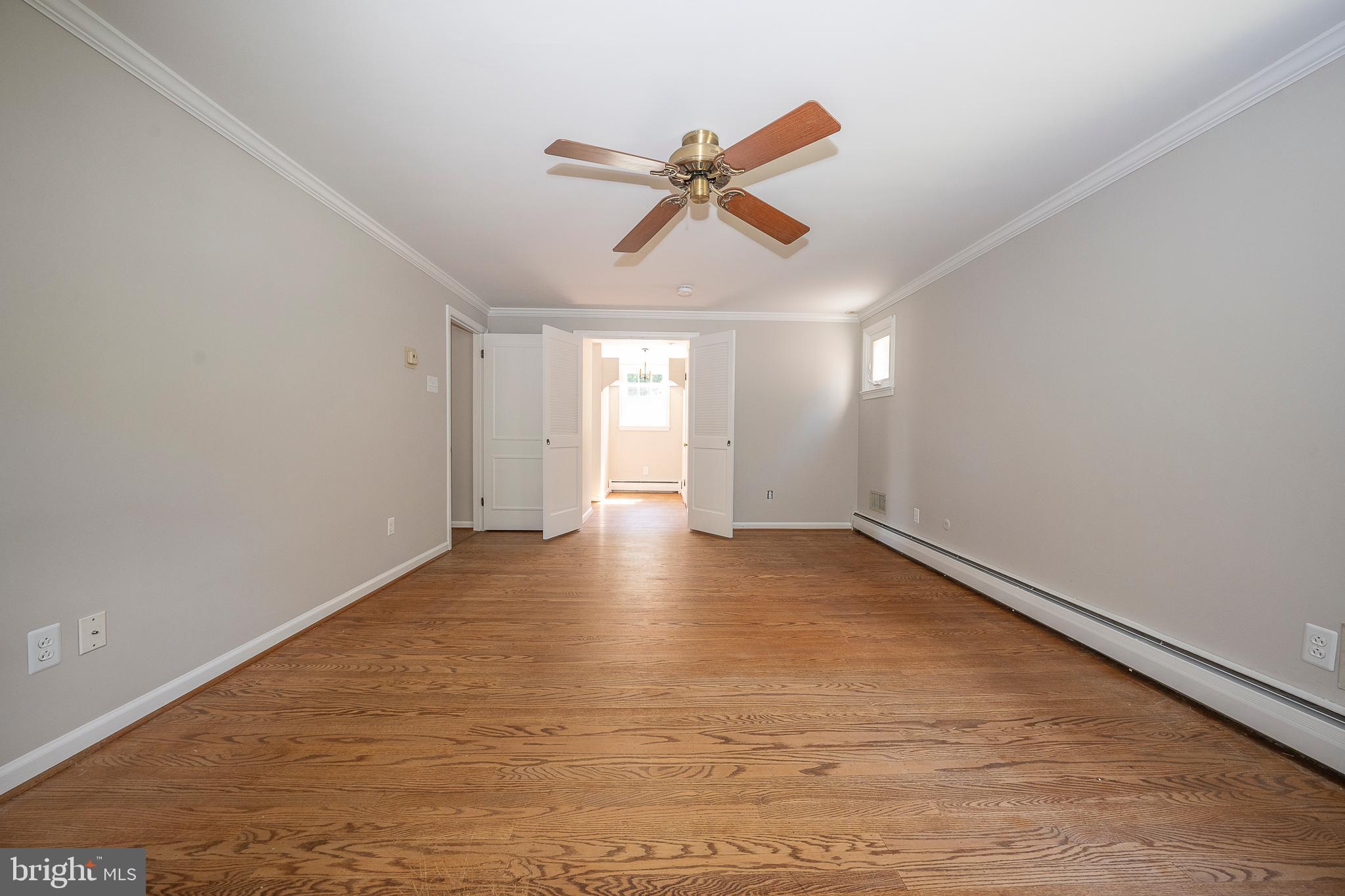 820 Milmar Road Newtown Square, PA 19073 - Photo 21 of 32 a view of empty room with wooden floor and ceiling fan