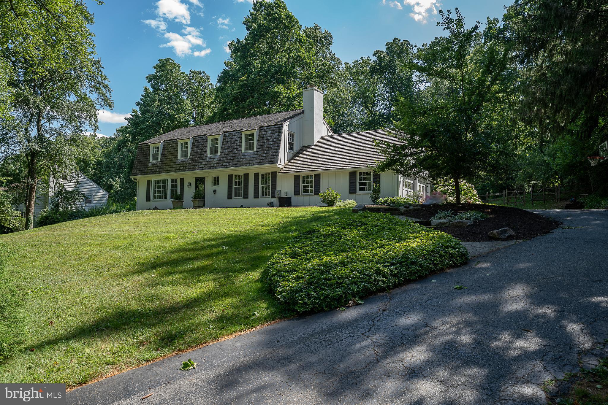820 Milmar Road Newtown Square, PA 19073 - Photo 26 of 32 a front view of a house with a yard