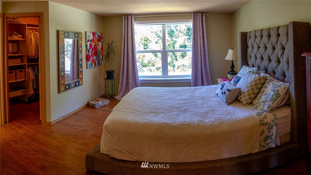 33027 20th Place Southwest Federal Way, WA 98023 - Photo 11 of 23 a bed sitting in a bedroom next to a window