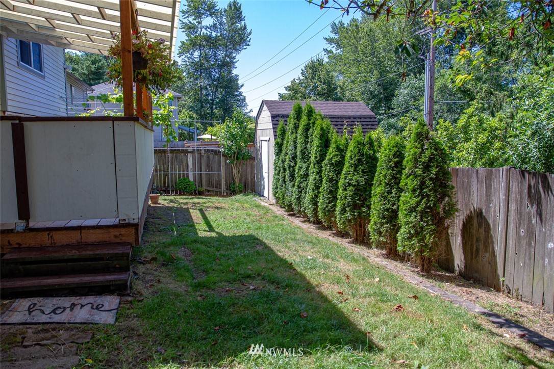 33027 20th Place Southwest Federal Way, WA 98023 - Photo 19 of 23 a view of a backyard with plants and large trees