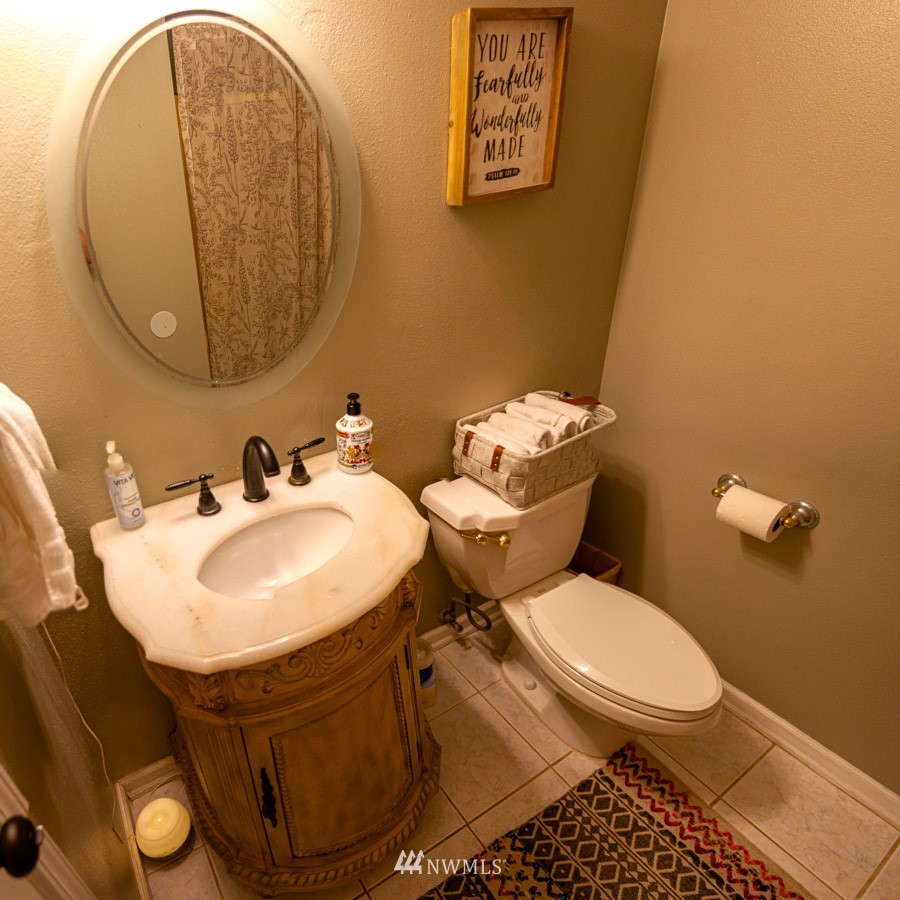 33027 20th Place Southwest Federal Way, WA 98023 - Photo 9 of 23 a bathroom with a sink a toilet and a mirror