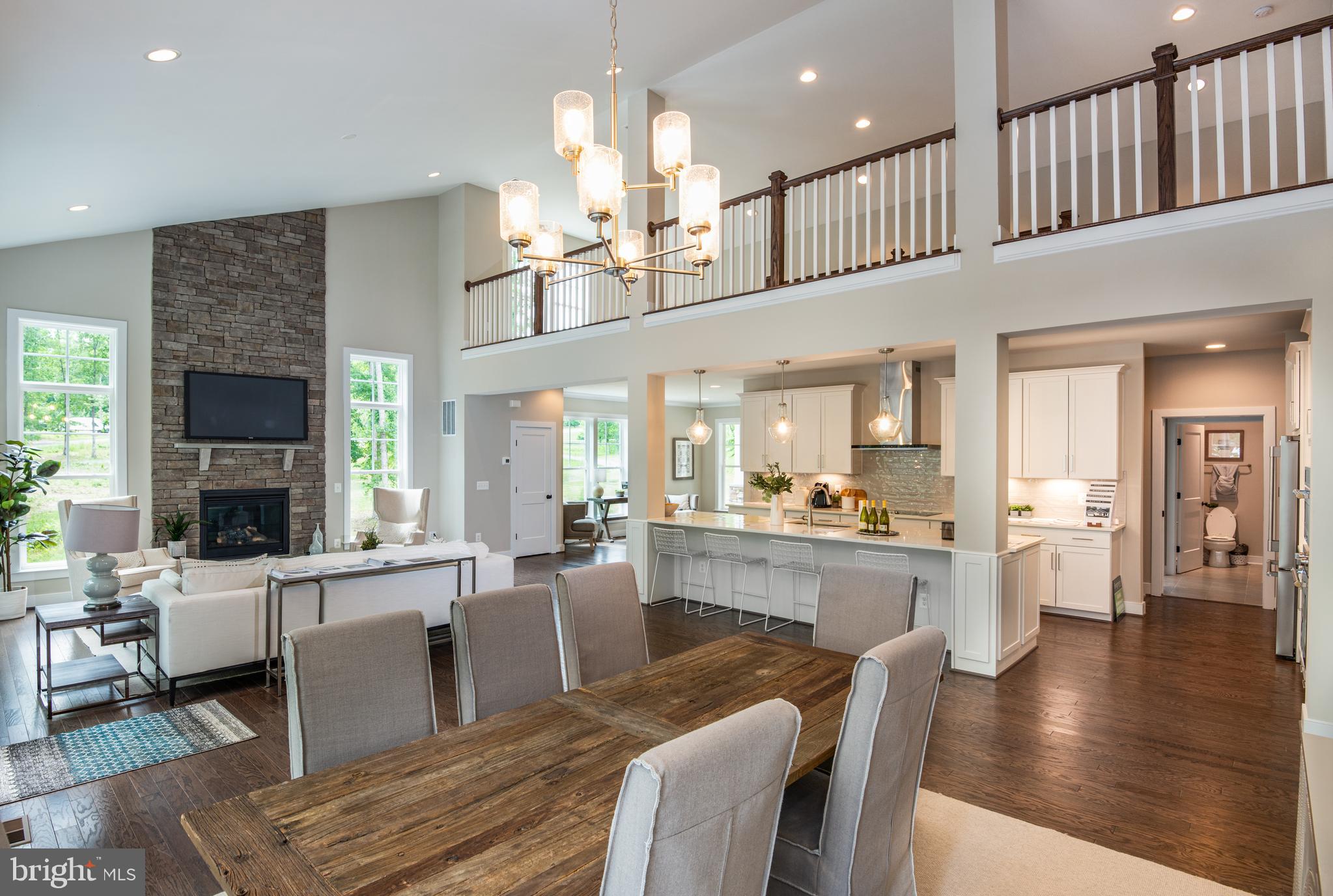 61 Compass Cove Mineral, VA 23117 - Photo 3 of 15 a living room with furniture a fireplace and a kitchen view