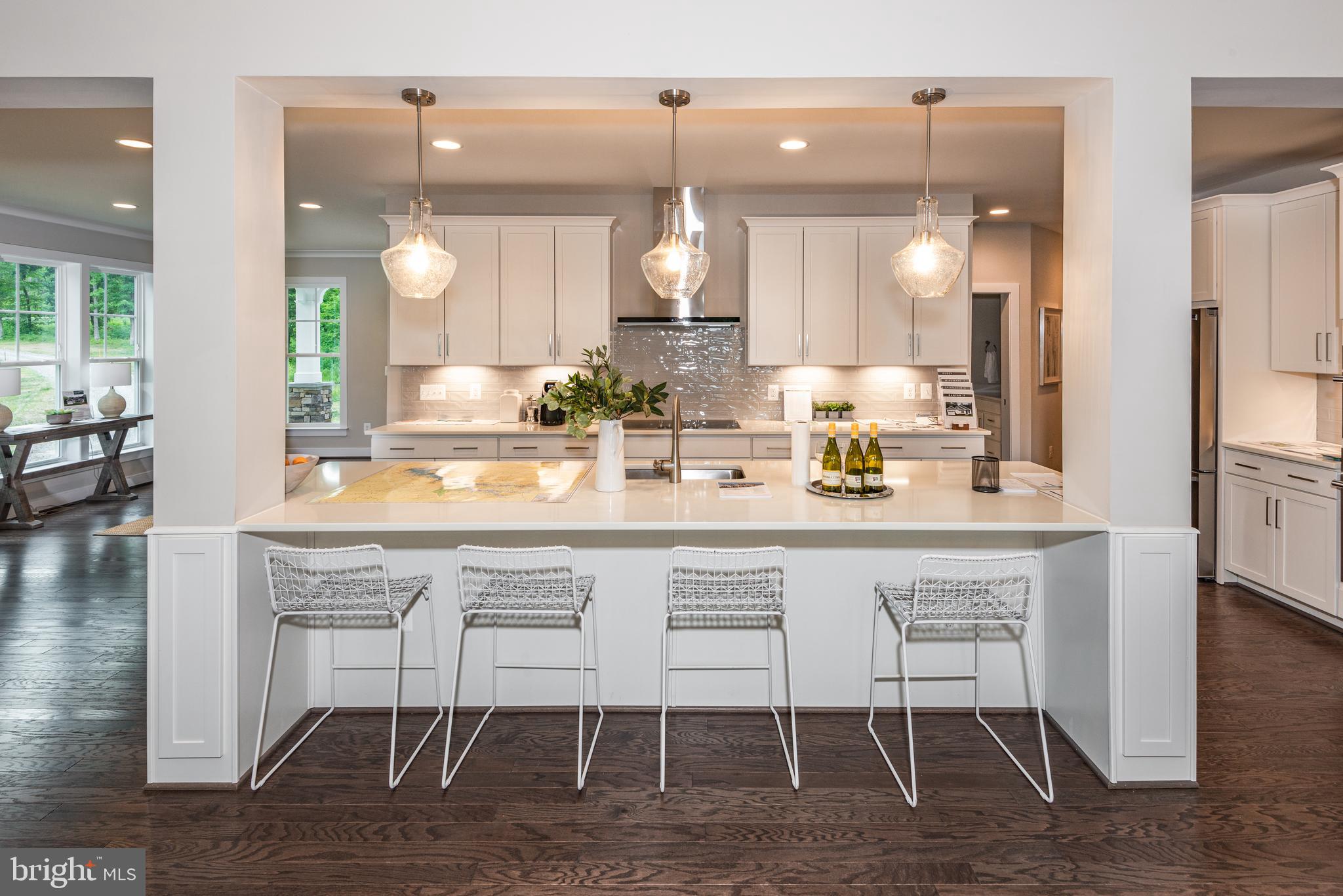 61 Compass Cove Mineral, VA 23117 - Photo 6 of 15 a kitchen with a dining table chairs and wooden floor