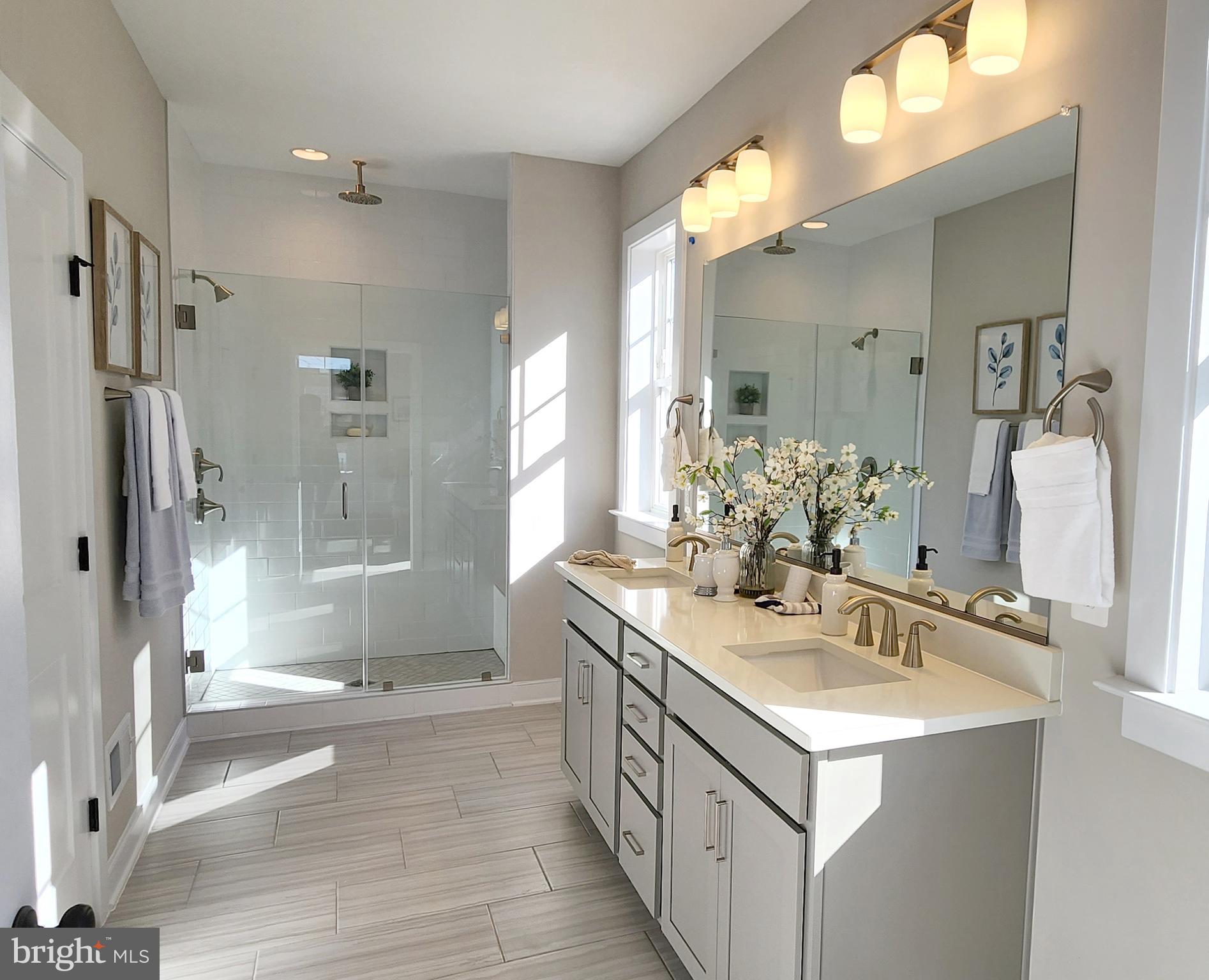 61 Compass Cove Mineral, VA 23117 - Photo 8 of 15 a bathroom with a double vanity sink mirror double and shower