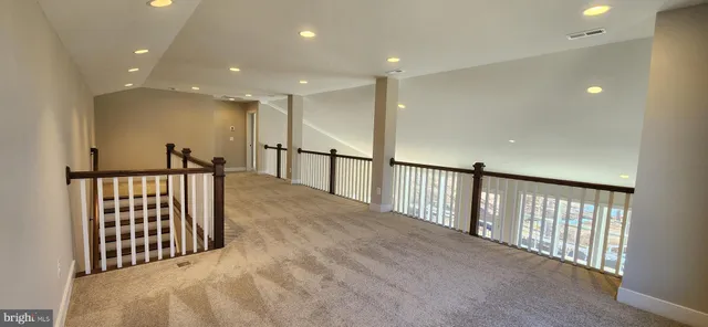 a view of staircase with lots of wooden floor