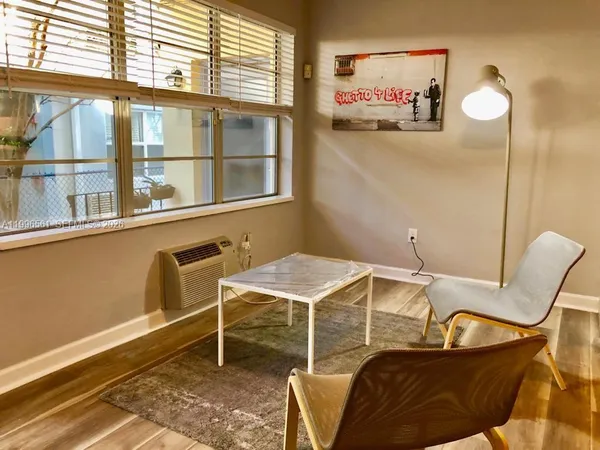 a room with furniture and a window