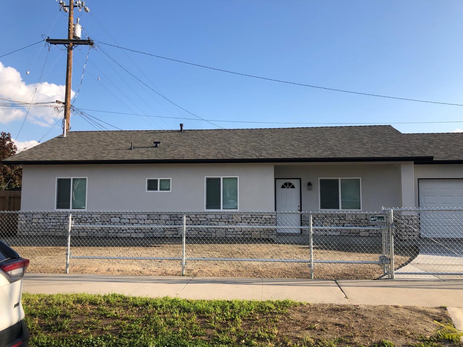 Undisclosed Address Wasco, CA 93280 - Photo 2 of 9 a view of house with outdoor space
