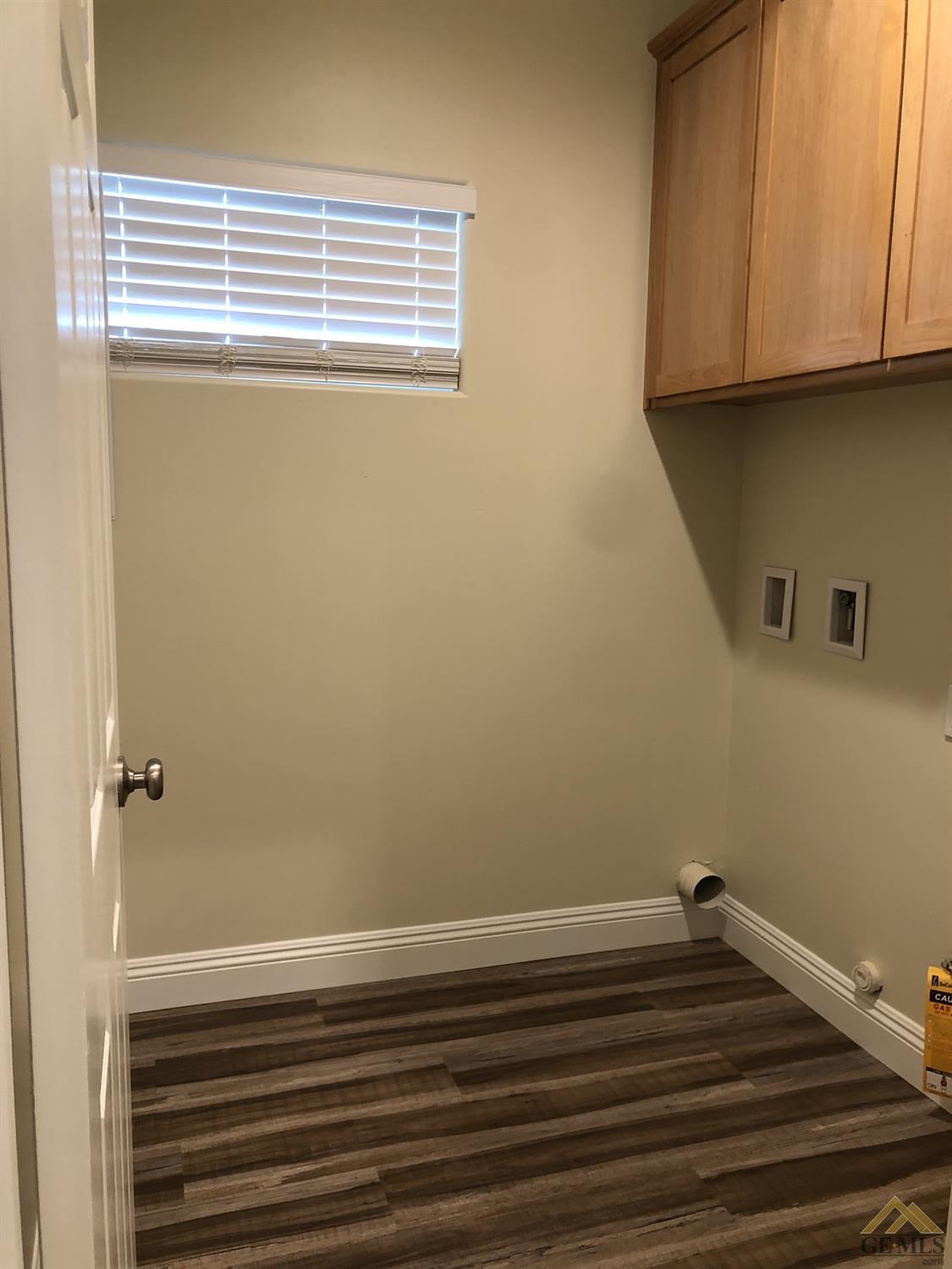 Undisclosed Address Wasco, CA 93280 - Photo 5 of 9 a view of a livingroom with wooden floor