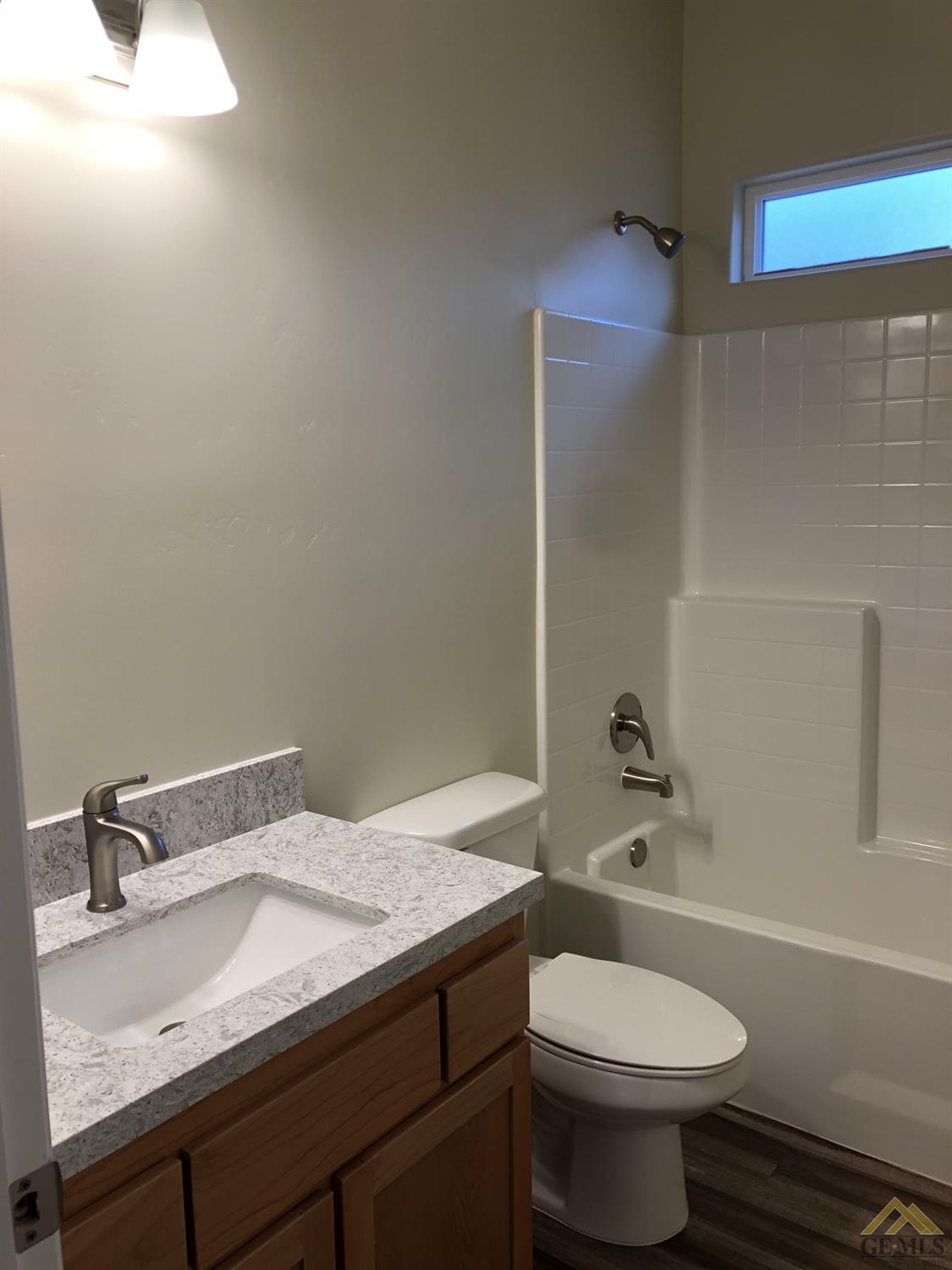 Undisclosed Address Wasco, CA 93280 - Photo 6 of 9 a bathroom with a sink toilet and shower