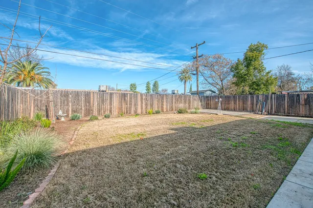 a view of backyard with a garden and outdoor seating