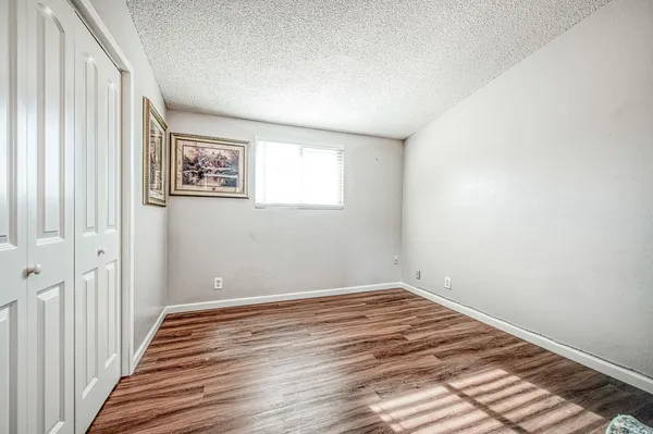 a view of a room with wooden floor and stairs