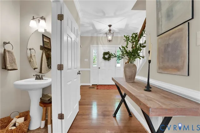 a view of an entryway with wooden floor