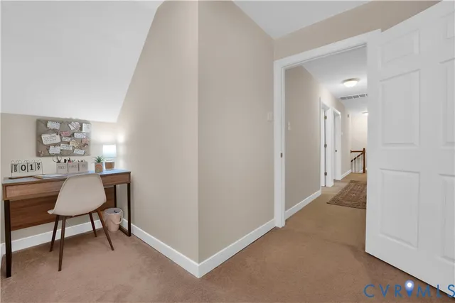 a bed room with a bed and a chair