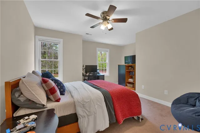 a bed room with a bed and a chandelier