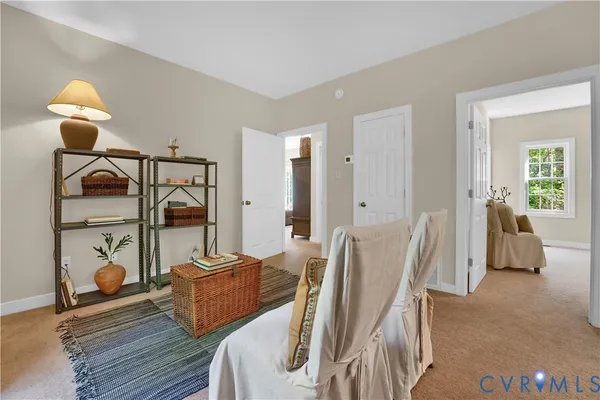 a bed room with furniture and a window