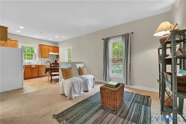a kitchen with a stove a sink and a refrigerator