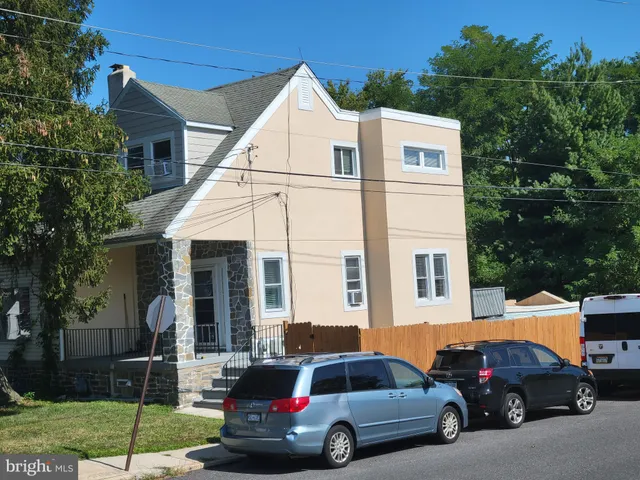 a car parked in front of a house