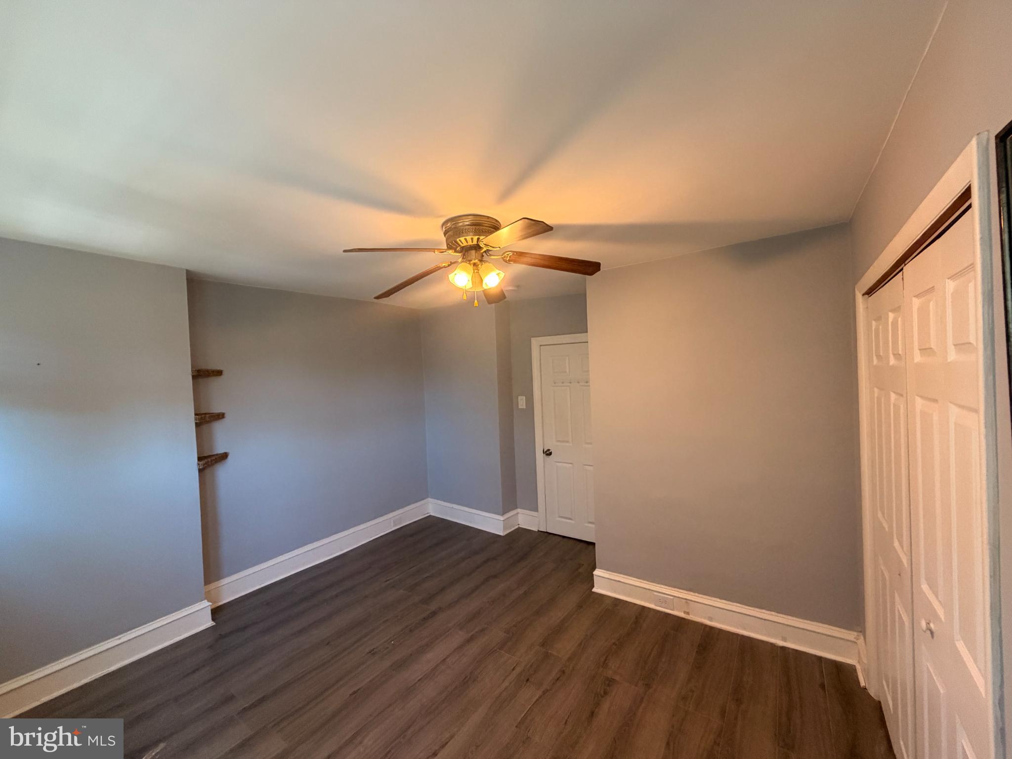 1101 Wilson Drive Havertown, PA 19083 - Photo 25 of 26 an empty room with wooden floor and windows