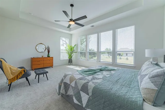 a bed room with a bed and a chandelier