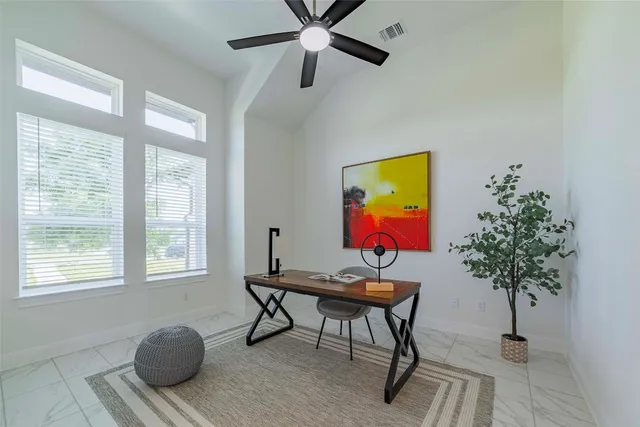 a workspace with furniture window and wooden floor