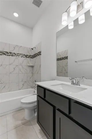 a bathroom with a sink a toilet and a bathtub