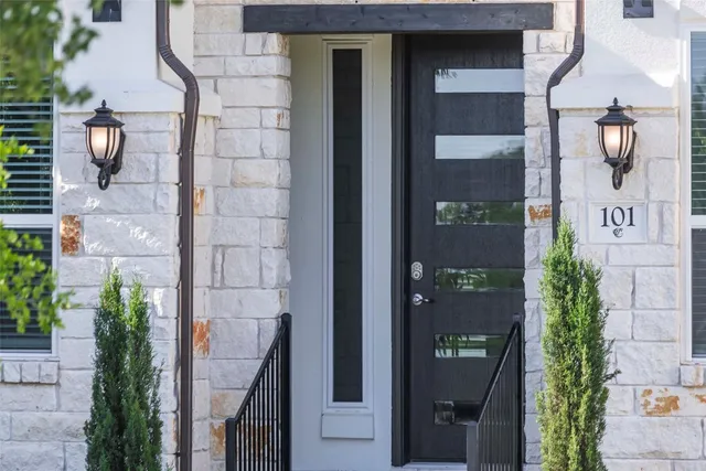 an front view of a house with a glass door