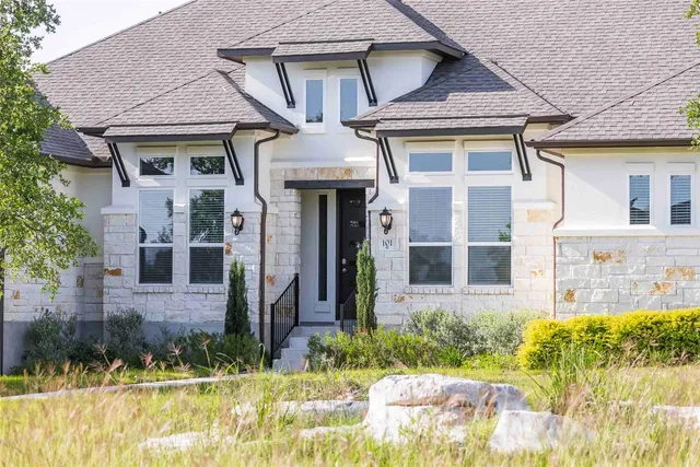front view of a house with a yard