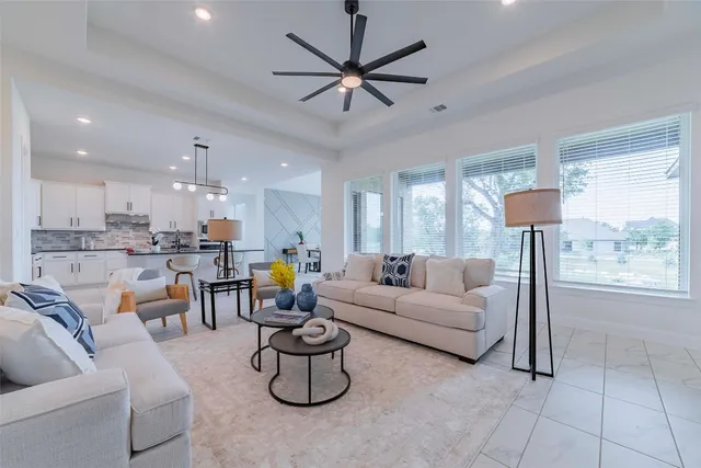 a living room with furniture and a table