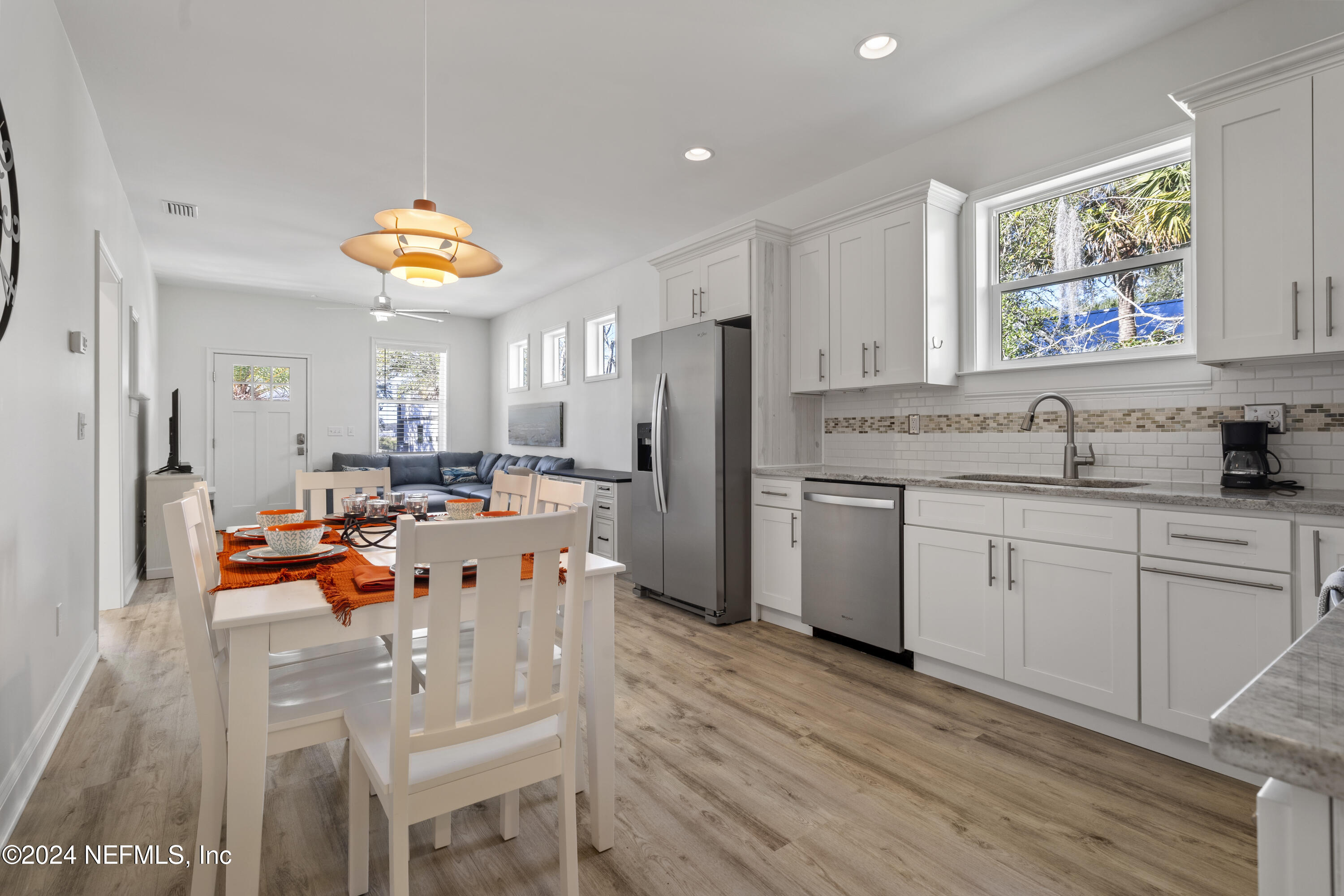 249 Riberia Street St. Augustine, FL 32084 - Photo 11 of 36 a kitchen with a sink appliances and cabinets