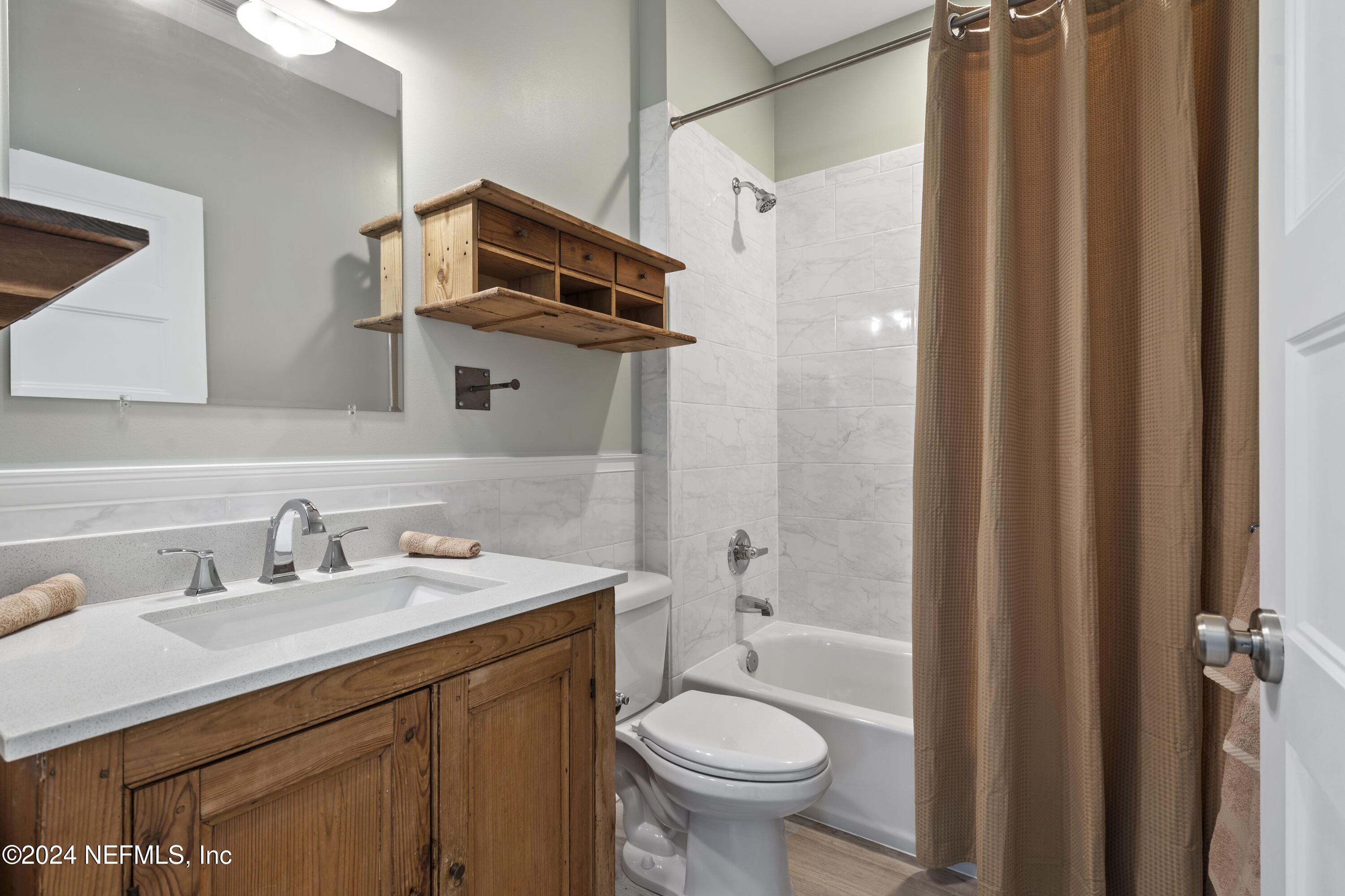 249 Riberia Street St. Augustine, FL 32084 - Photo 20 of 36 a bathroom with a sink toilet and shower