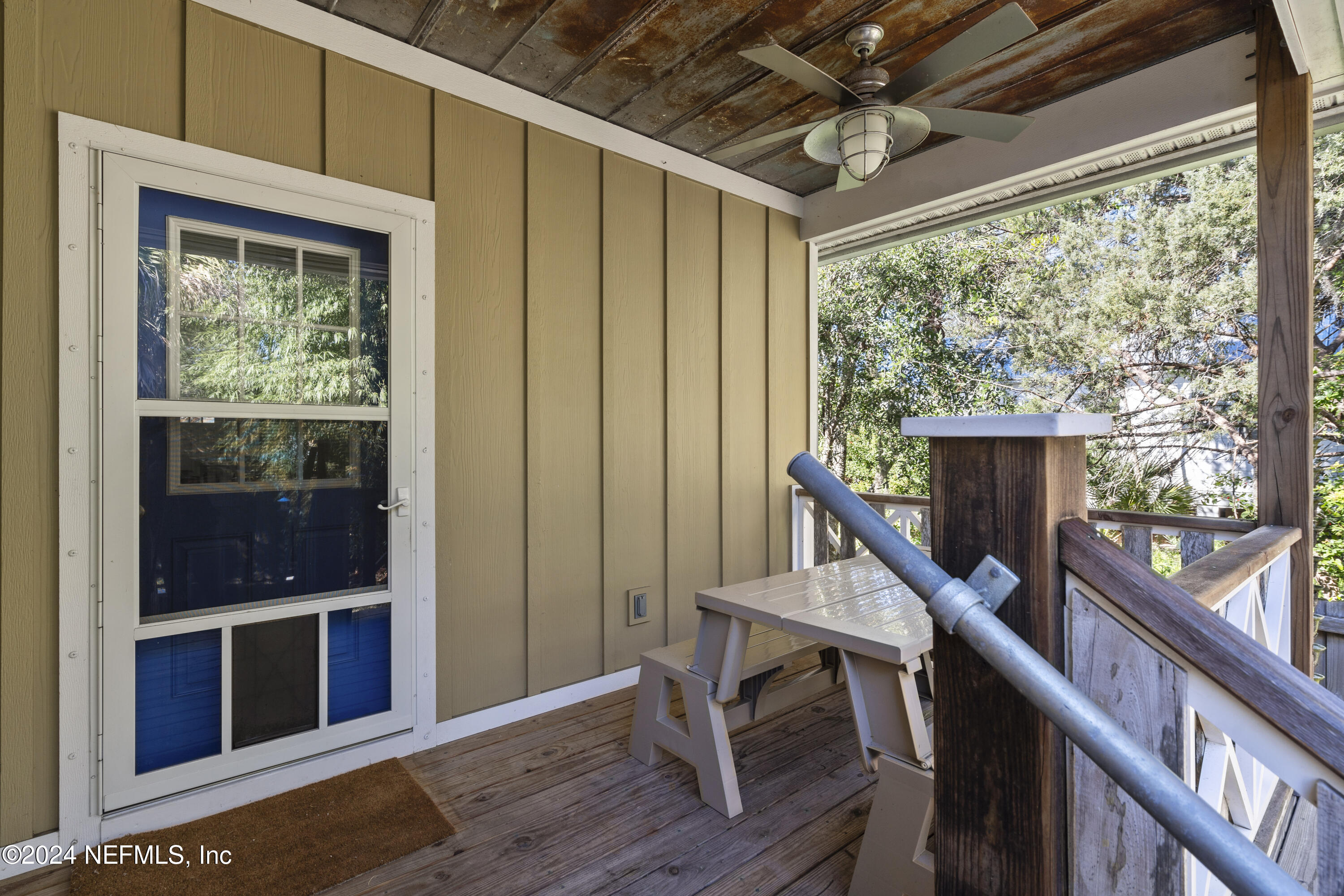 249 Riberia Street St. Augustine, FL 32084 - Photo 25 of 36 a view of a hallway with wooden floor and furniture