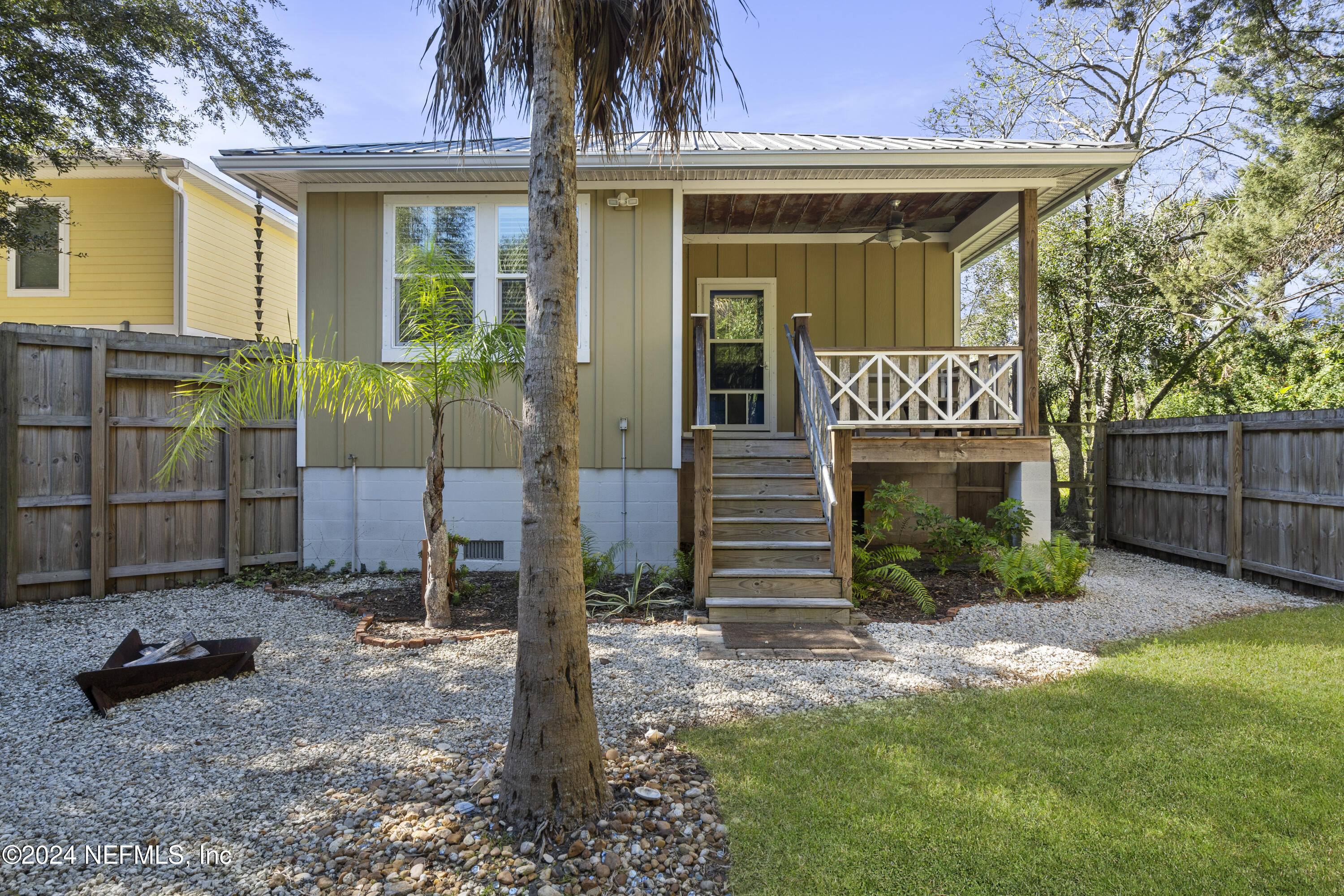 249 Riberia Street St. Augustine, FL 32084 - Photo 27 of 36 a front view of a house with a yard