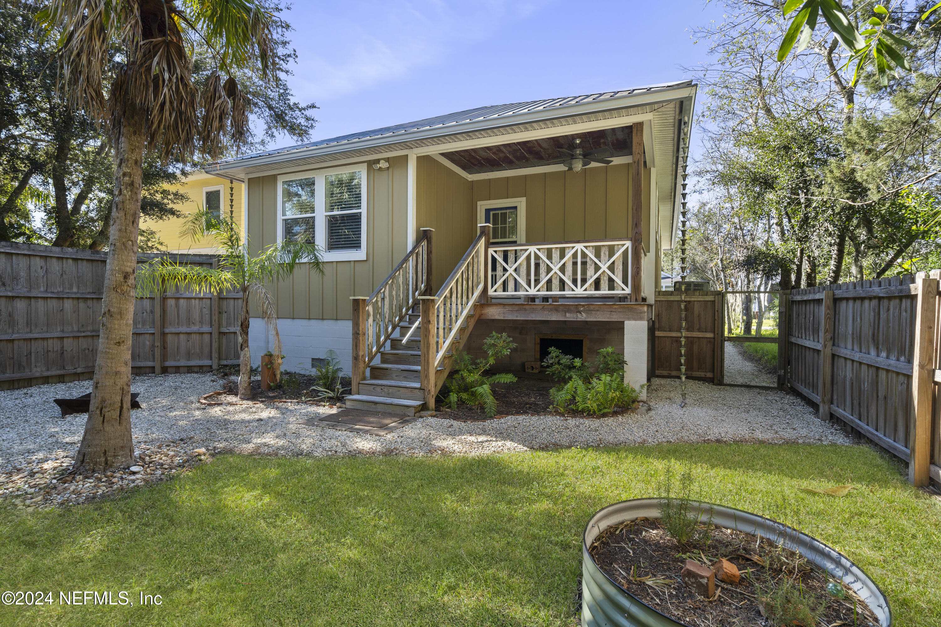 249 Riberia Street St. Augustine, FL 32084 - Photo 31 of 36 a front view of a house with garden