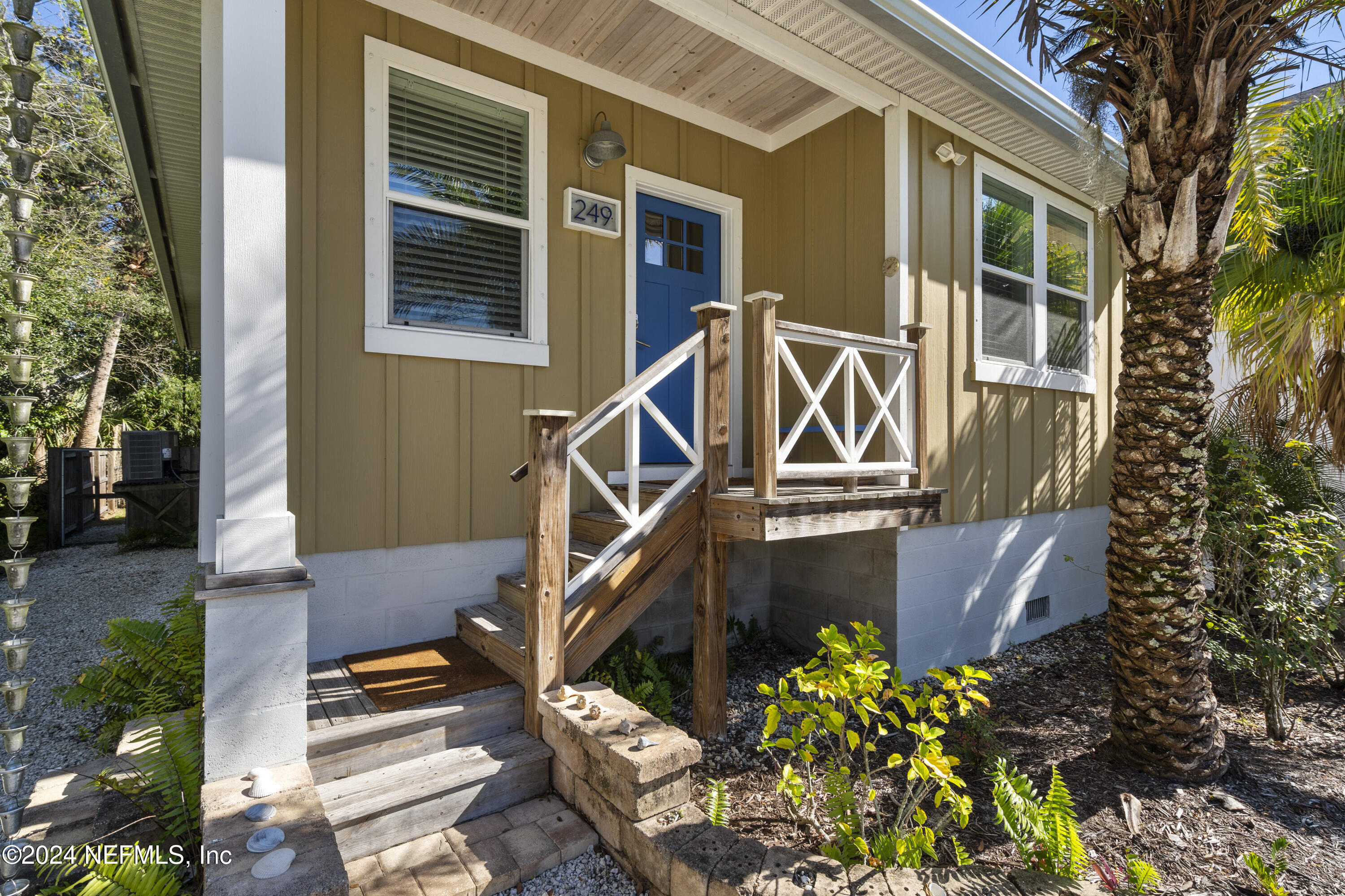 249 Riberia Street St. Augustine, FL 32084 - Photo 7 of 36 a front view of a house with a yard