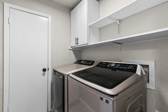 a white stove top oven sitting inside of a kitchen