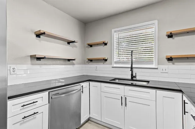 a kitchen with appliances cabinets and a counter top