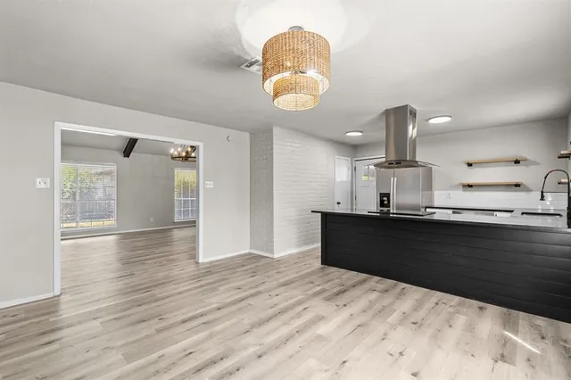 a kitchen with granite countertop a stove and a sink