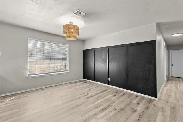 a view of a livingroom with a ceiling fan and window