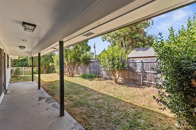 a house view with a backyard space