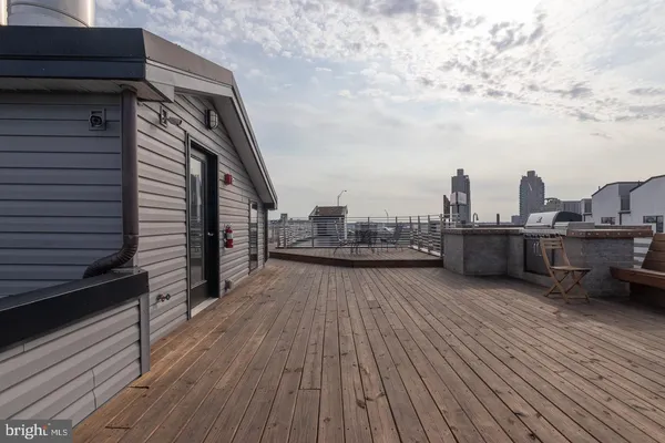 a view of roof deck with patio