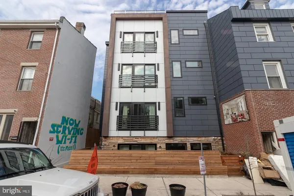 a front view of a house with large windows
