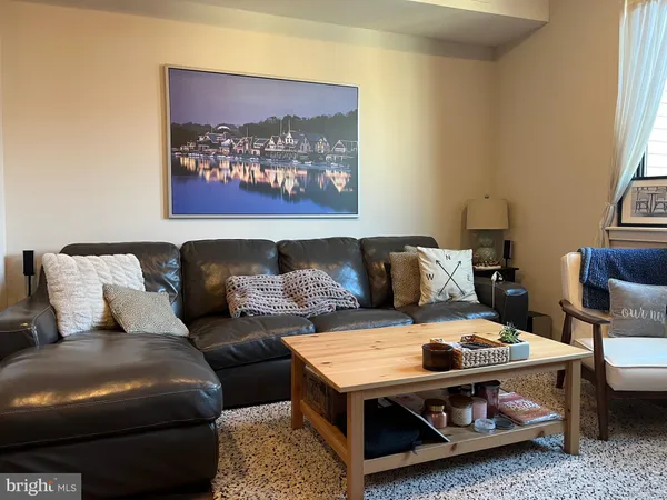 a living room with furniture and a couch