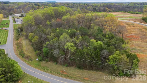 a view of a swimming pool with a yard and mountain view