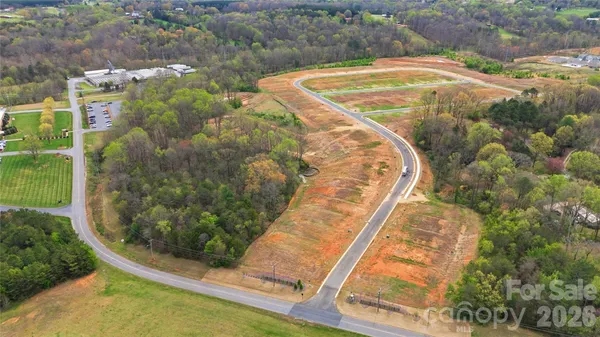 a view of a swimming pool with a yard